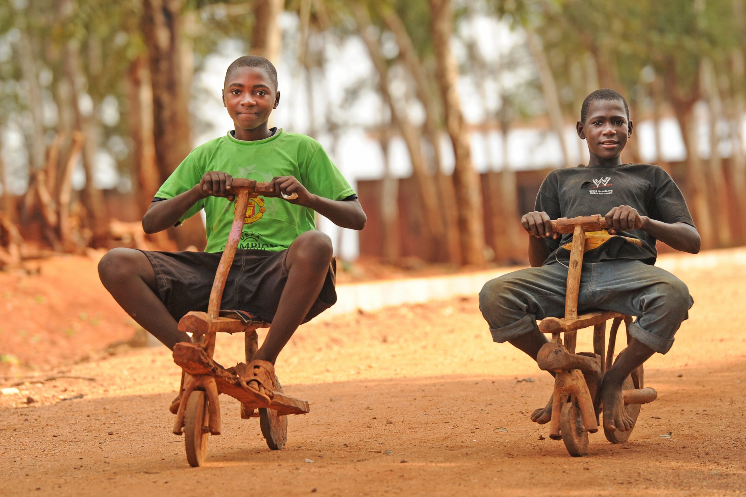 two boys on a selfmade bike in tanzania. © Eric Tkindt/ BIKE Magazine