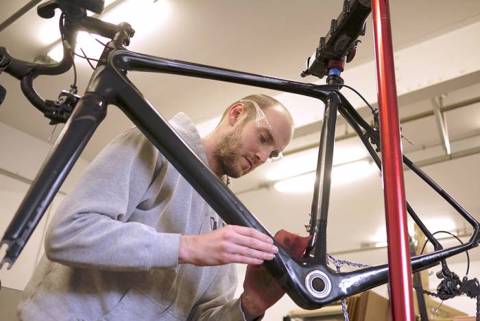Matt Appleman of Appleman Cycles repairs a carbon frame.